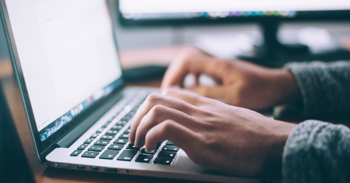 A person on a computer; what is the difference between AI and plagiarism?