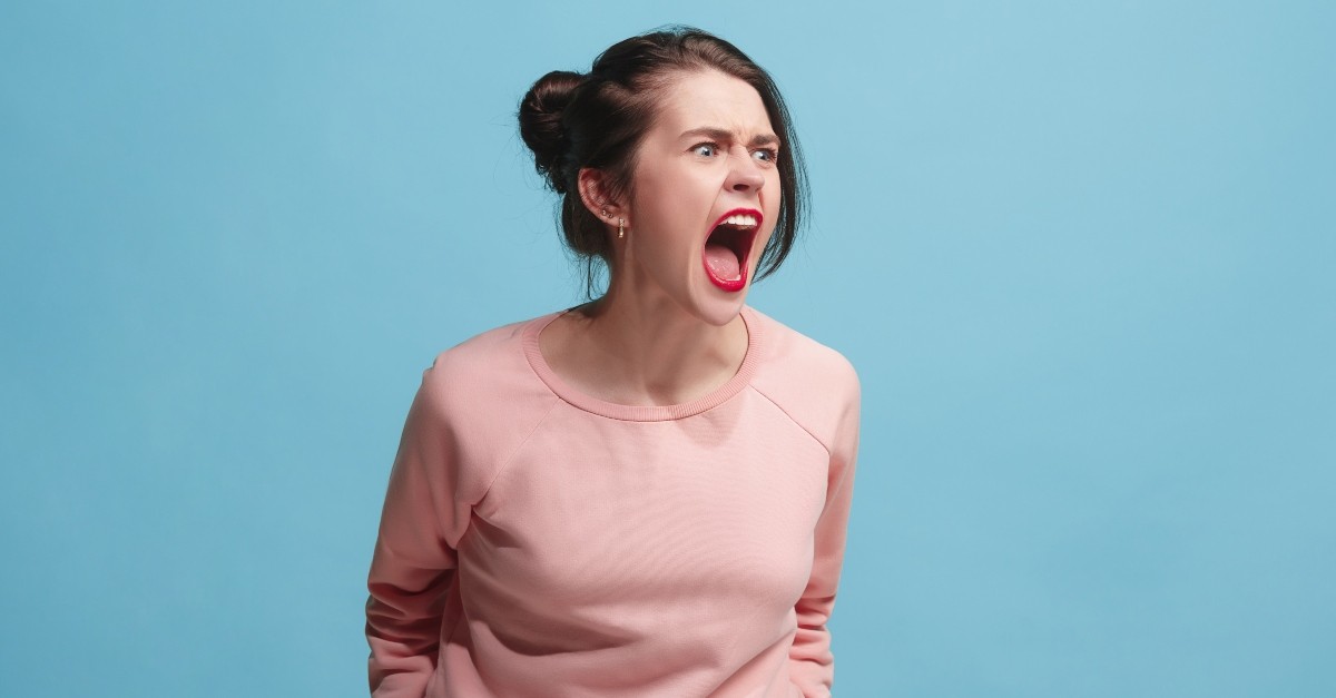 Angry woman yelling loudly