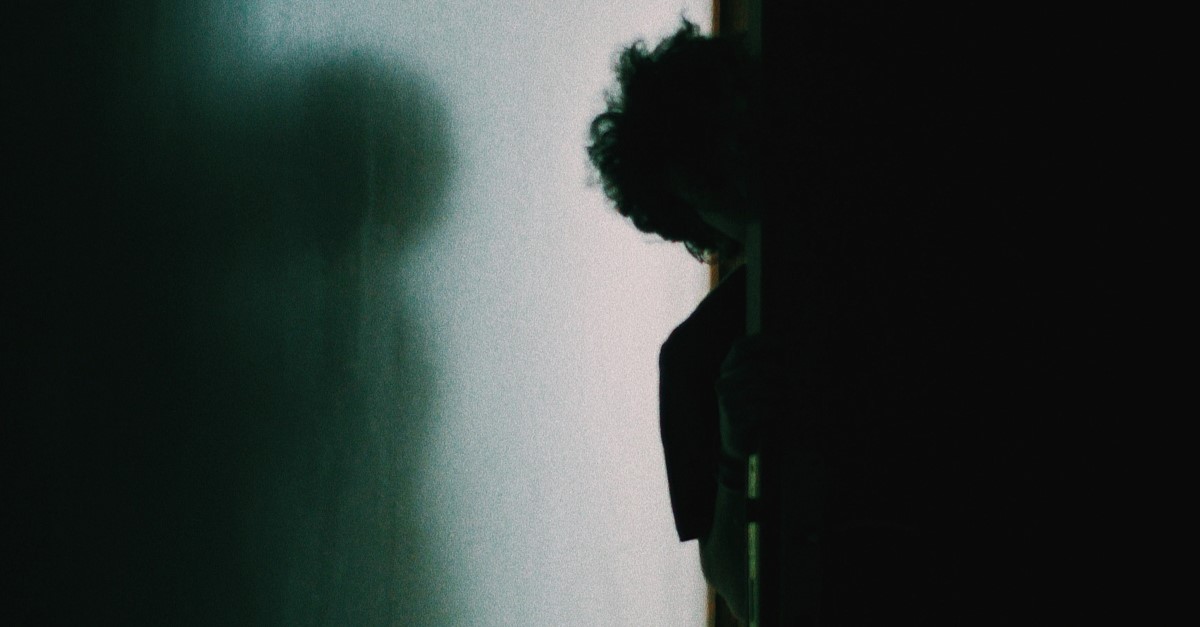 man hiding in inner room