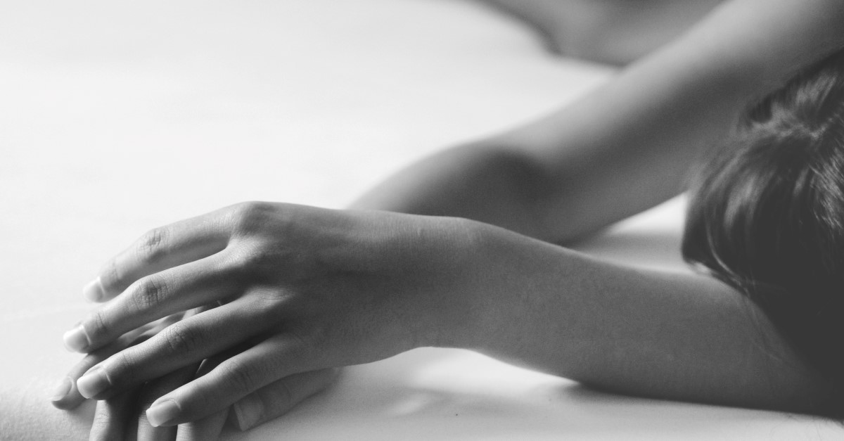 dead woman lying on ground